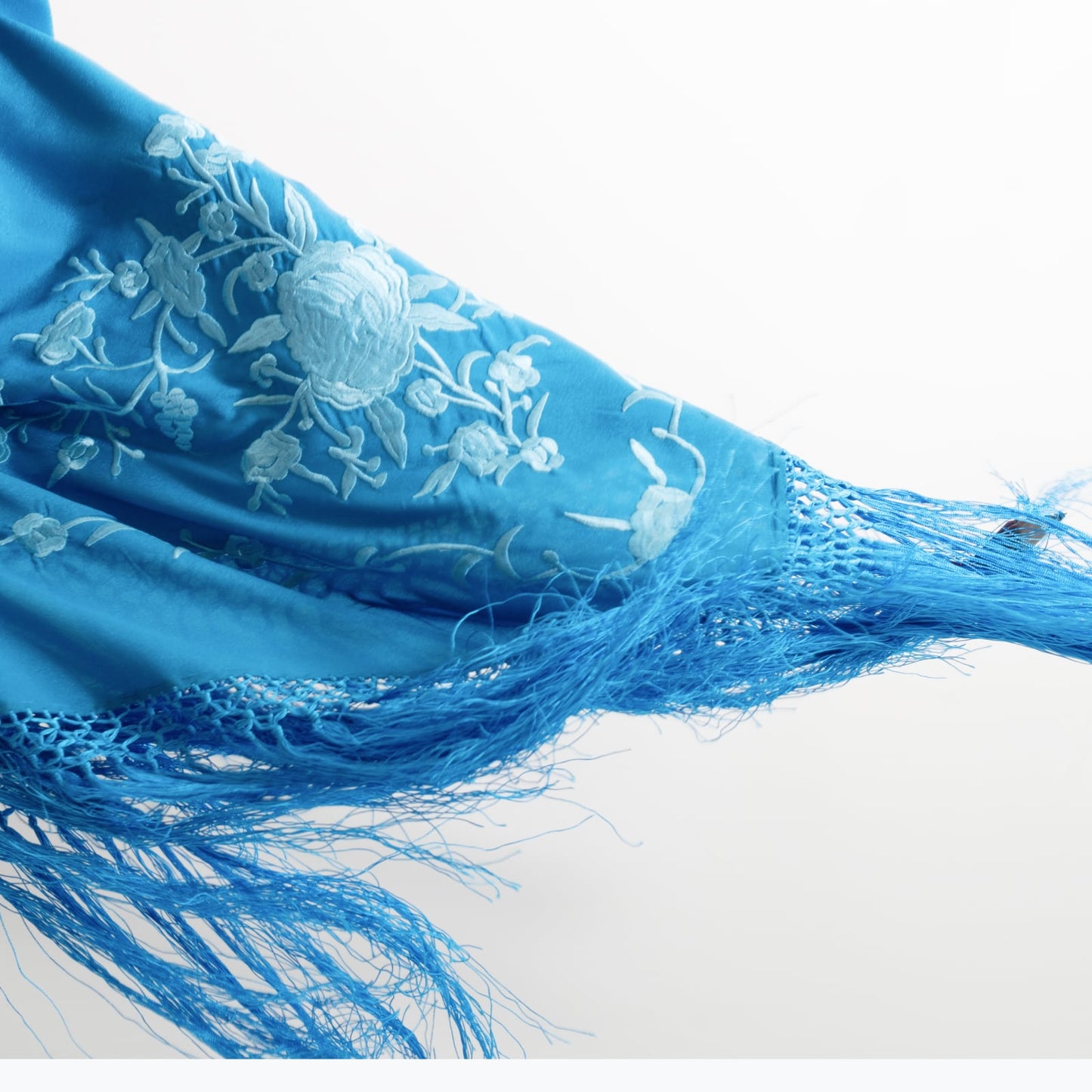 Blue floral embroidered mantoncillo shawl.