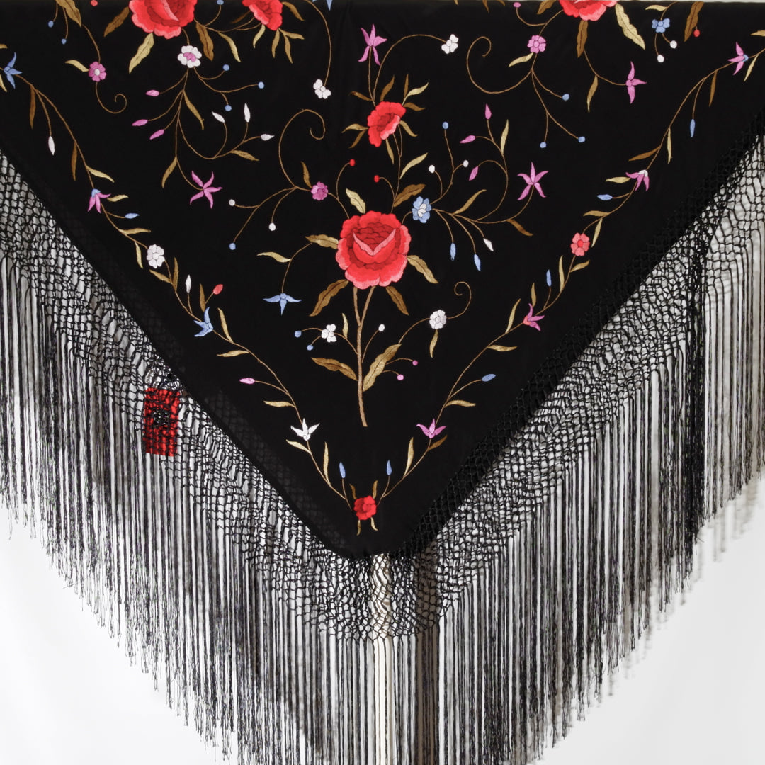 Black scarf with floral embroidery and fringe details