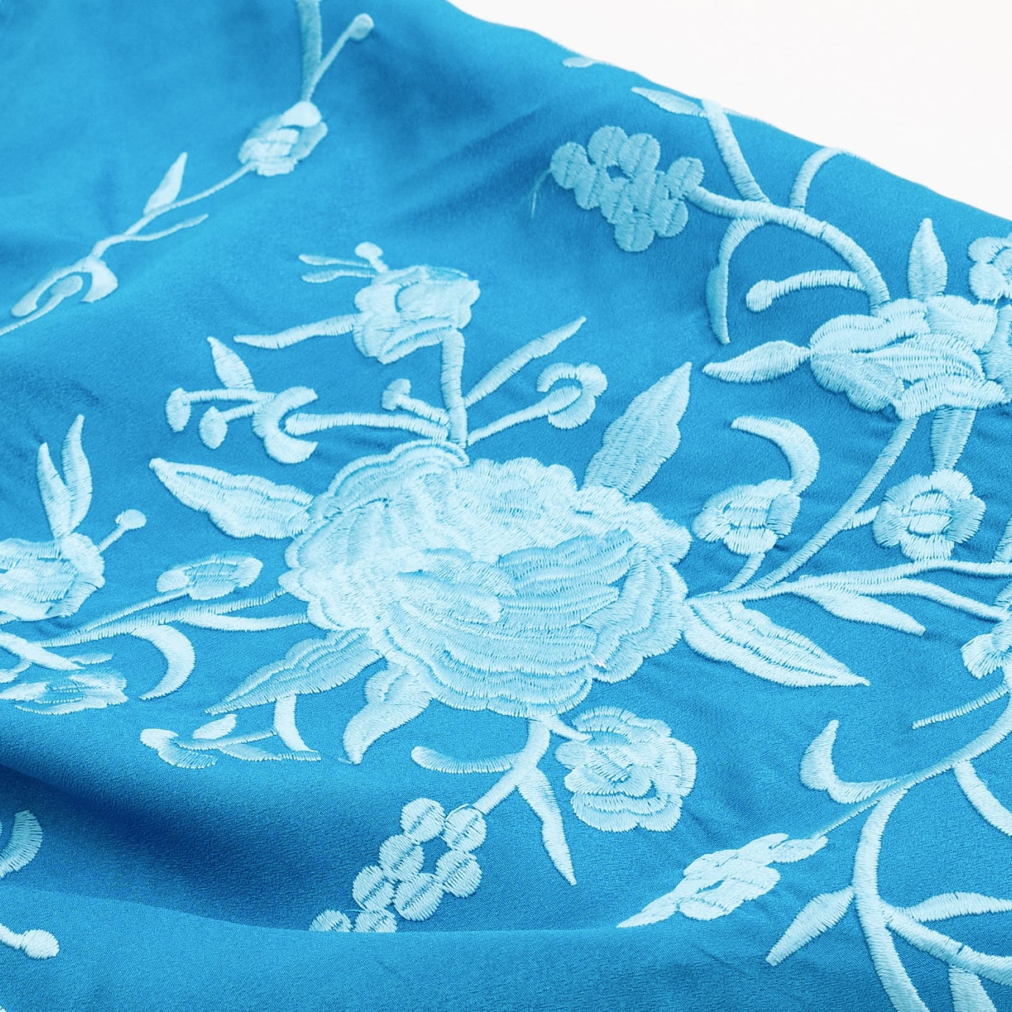 Blue Miami floral embroidered mantoncillo shawl.